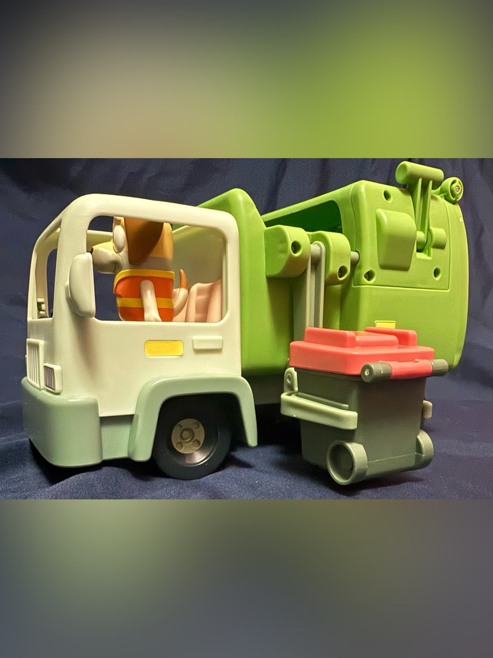 Bluey Garbage Truck playset featuring a poseable figure and trash bin